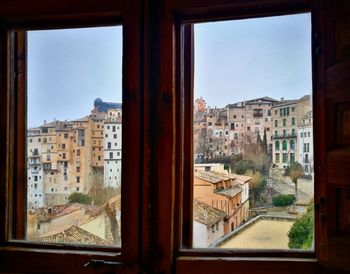 Cityscape seen through glass window