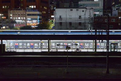 Train on railroad station platform at night in seoul