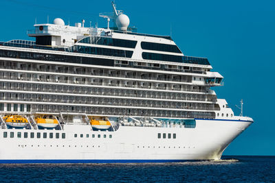 Ship in sea against blue sky
