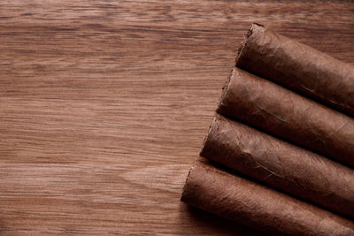 High angle view of cigarette on wooden table