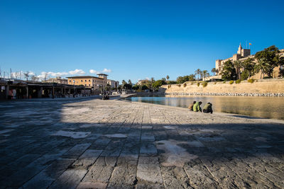 View of built structures against clear blue sky