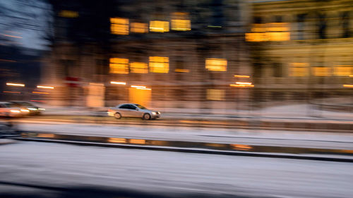 Blurred motion of car on street at night