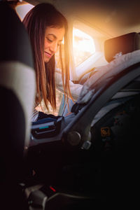 Woman sitting in car