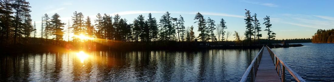 Scenic view of river at sunset