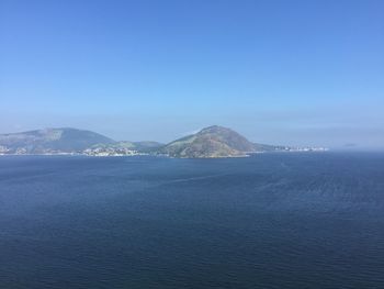 Scenic view of sea against clear blue sky