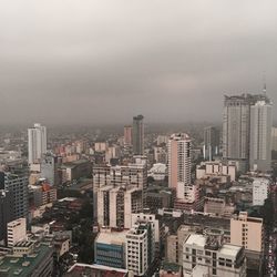High angle view of buildings in city against sky