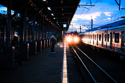 Landscape view of the train arrival at sunset