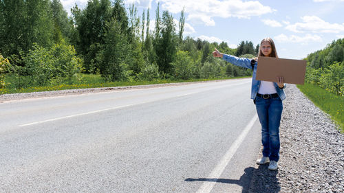 Rear view of man standing on road