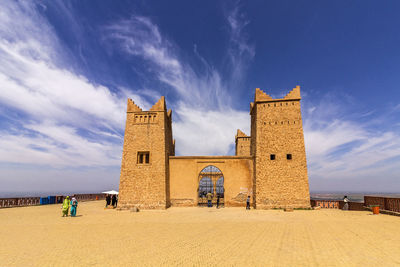 Panoramic view of beach and buildings against sky