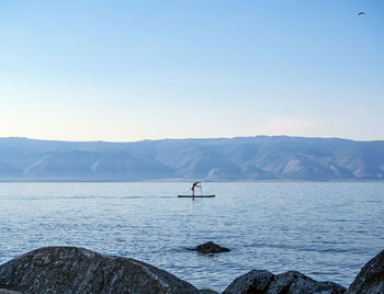 Standup paddle boarding in baikal lake