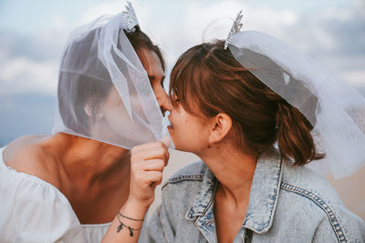 Portrait of mother and daughter outdoors