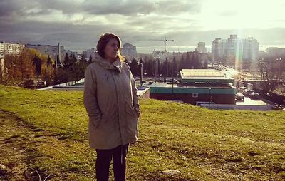 Woman standing in front of building