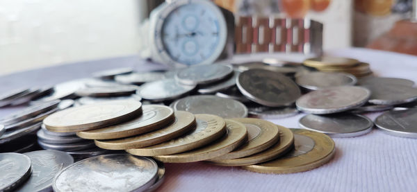 Close-up of coins on table