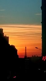 Silhouette buildings at sunset
