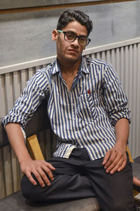 Portrait of young man wearing eyeglasses