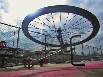 Bicycle against sky in city