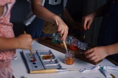 Midsection of people working at table