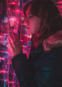Portrait of young woman looking away