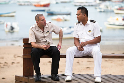 Men sitting on bench