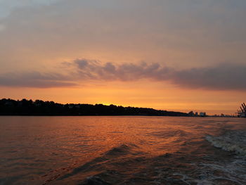 Scenic view of sea against sky at sunset