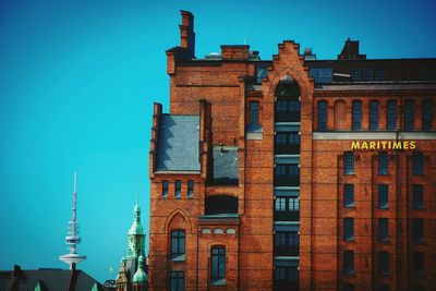 Low angle view of building against blue sky