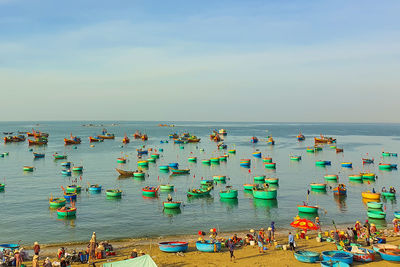 High angle view of boats in sea against sky