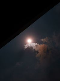 Low angle view of silhouette moon against sky at sunset