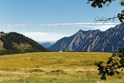 Scenic view of landscape and mountains against sky