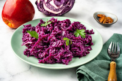 High angle view of chopped fruits in plate on table