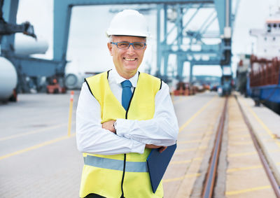 Portrait of engineer standing on dock