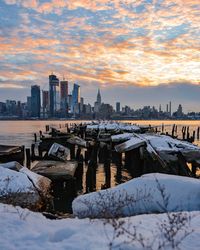 View of city during winter at sunset