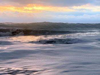 Scenic view of sea against sky during sunset