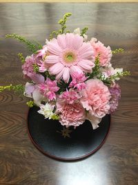 Close-up of pink flowers on table