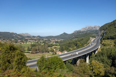 Scenic view of mountains against clear blue sky