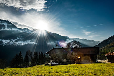 Scenic view of mountains against cloudy sky