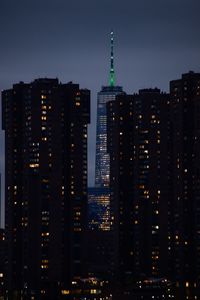 Illuminated buildings in city at night