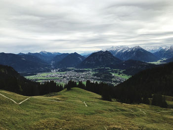 Scenic view of landscape and mountains against sky