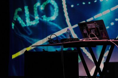 Close-up of illuminated lighting equipment on table