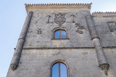 Low angle view of old building against clear sky
