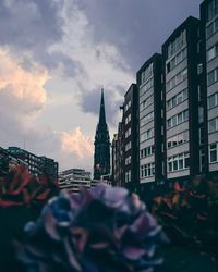 View of buildings in city against sky