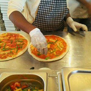 Midsection of man preparing food