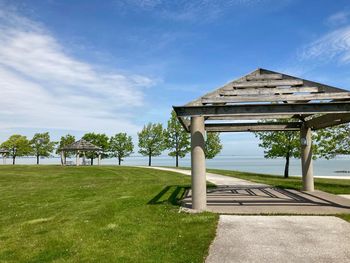 Gazebo on field against sky