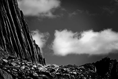 Low angle view of rocks against sky