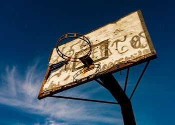 Low angle view of basketball hoop against sky