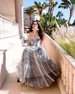 Full length of woman wearing bridal clothing standing outdoors