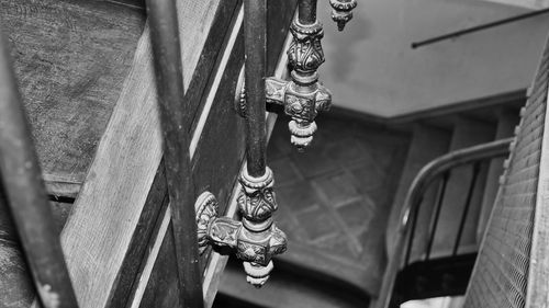 Close-up of cross on metal door