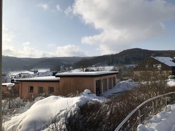 Buildings against sky during winter