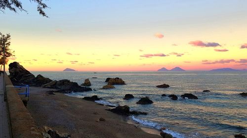 Scenic view of sea against sky during sunset