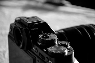 Close-up of camera on table