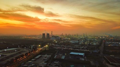 High angle view of illuminated buildings against sky during sunset